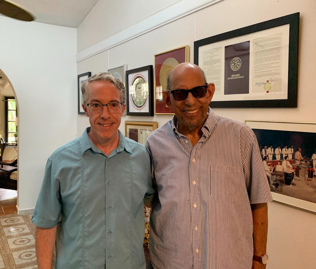 Daniel Piper with salsa legend Willie Rosario Major Latin music recording artist Willie Rosario in his house in San Juan, Puerto Rico with MIM curator and public educator Daniel Piper. Awards showing in the background.